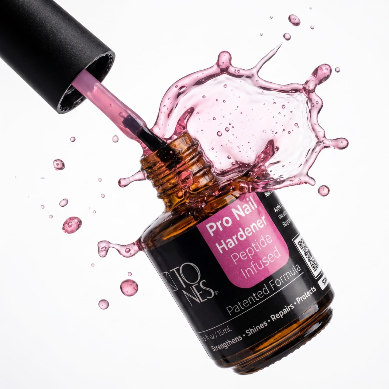 Pro Nail Hardener peptide treatment bottle with pink formula splash